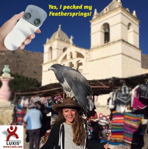 Girl on vacation with a bird on her head. Featherspring Foot Supports pictured and caption: Yes, I packed my Feathersprings!